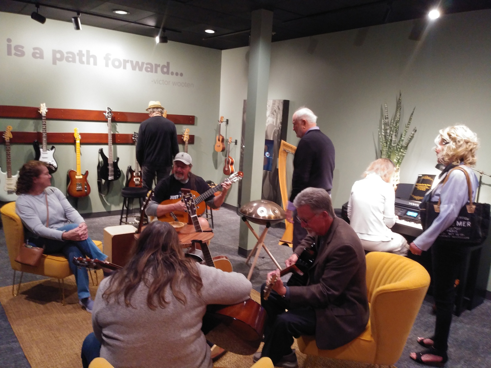 adults jam in the interactive room