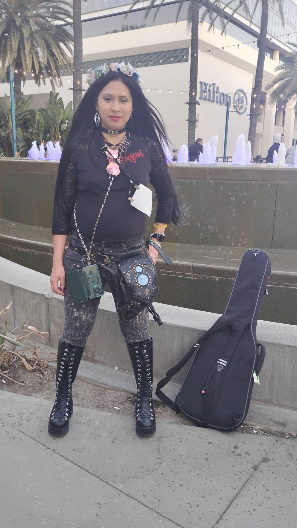 girl with tall black boots outside the namm show