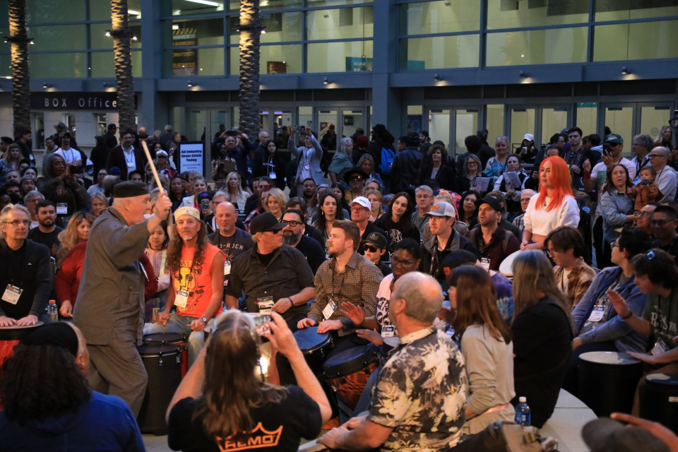 namm show attendees participate in a drum circle