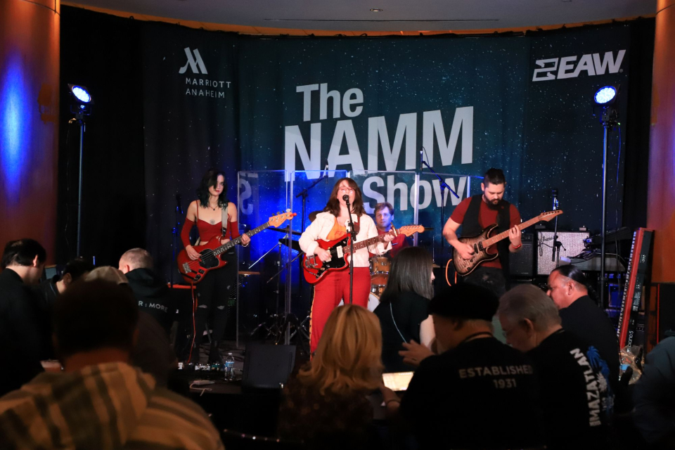 a band performs at the namm show