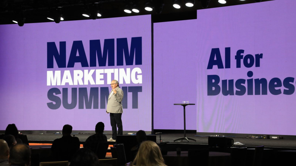 speaker discusses AI marketing trends at the namm show