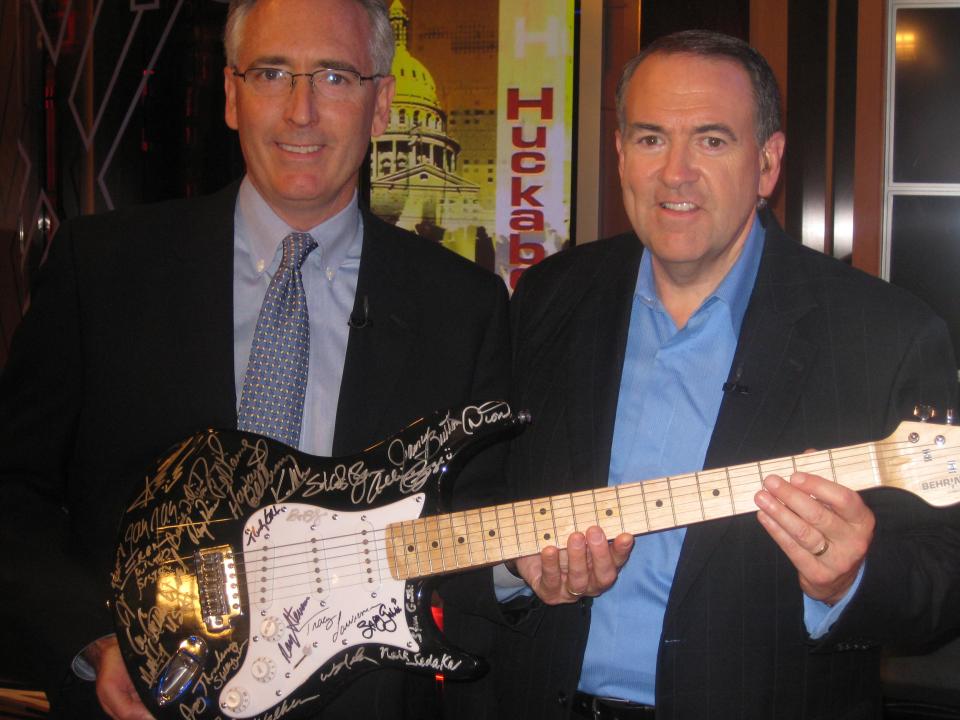WPF_auction_guitar.jpg Joe and Huckabee with wpf guitar