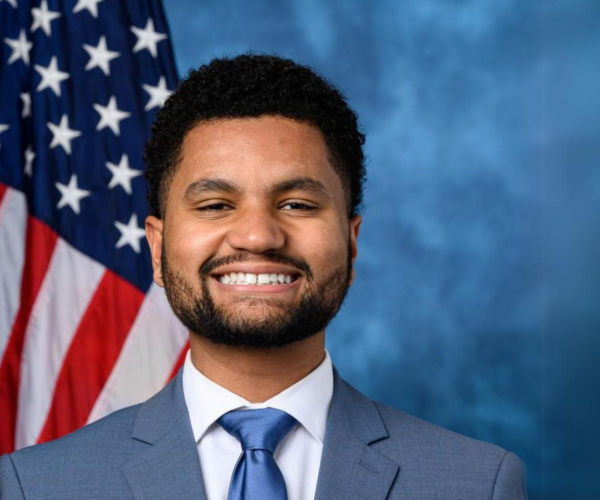 rep maxwell frost in front of american flag