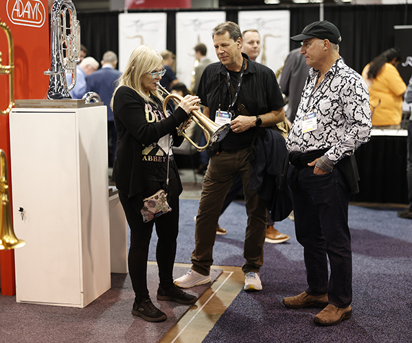 Exhibitors and buyers testing products at The NAMM Show